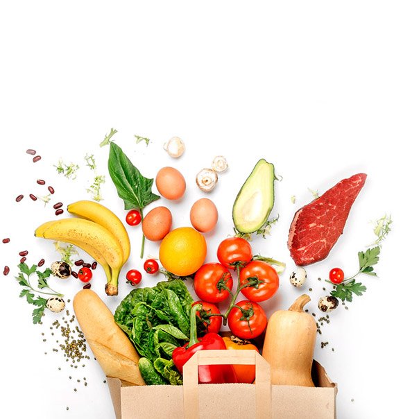 Full paper bag of different health food on a white background. Top view. Flat lay